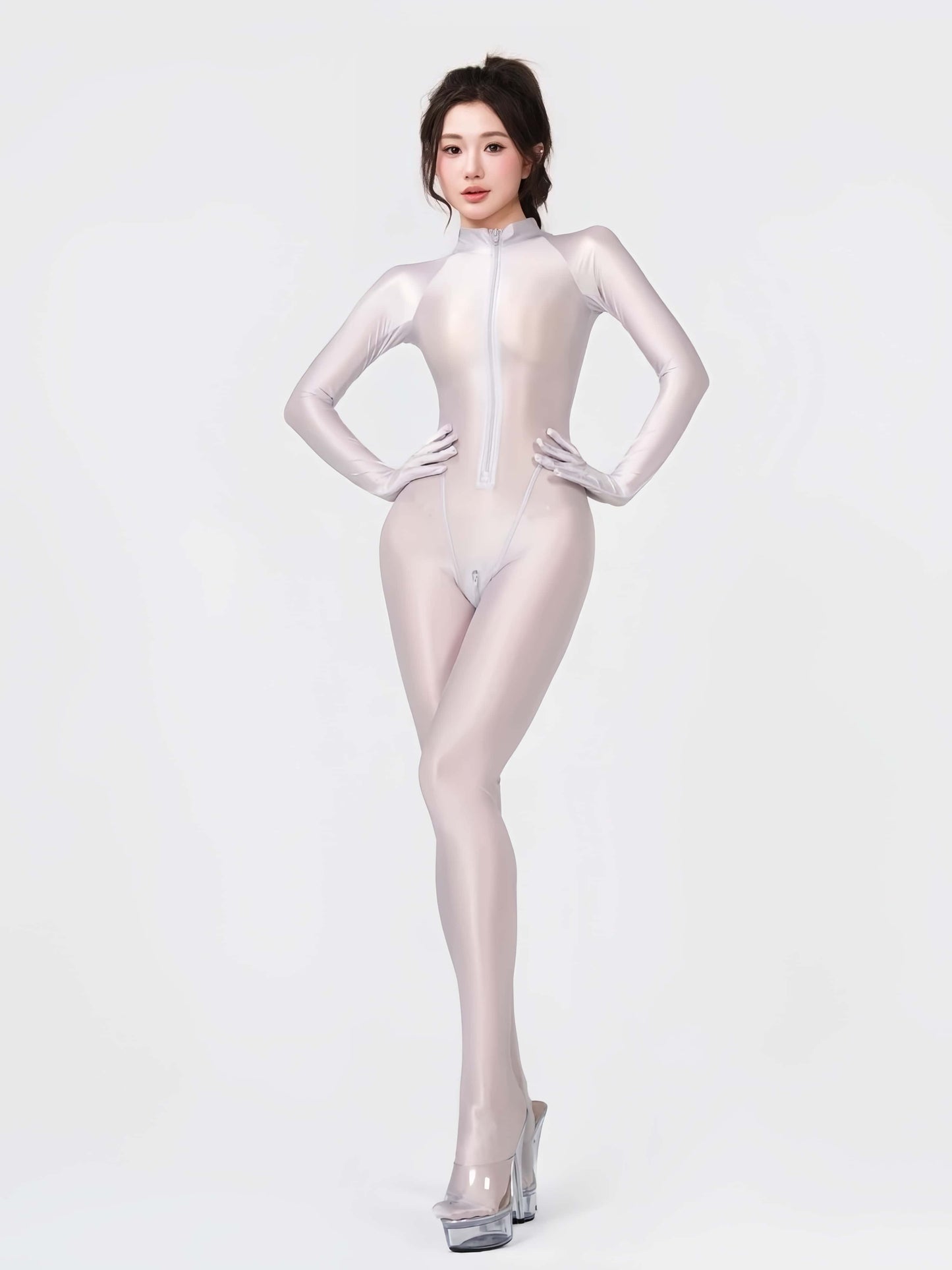 Person wearing a shiny white bodysuit on a white background