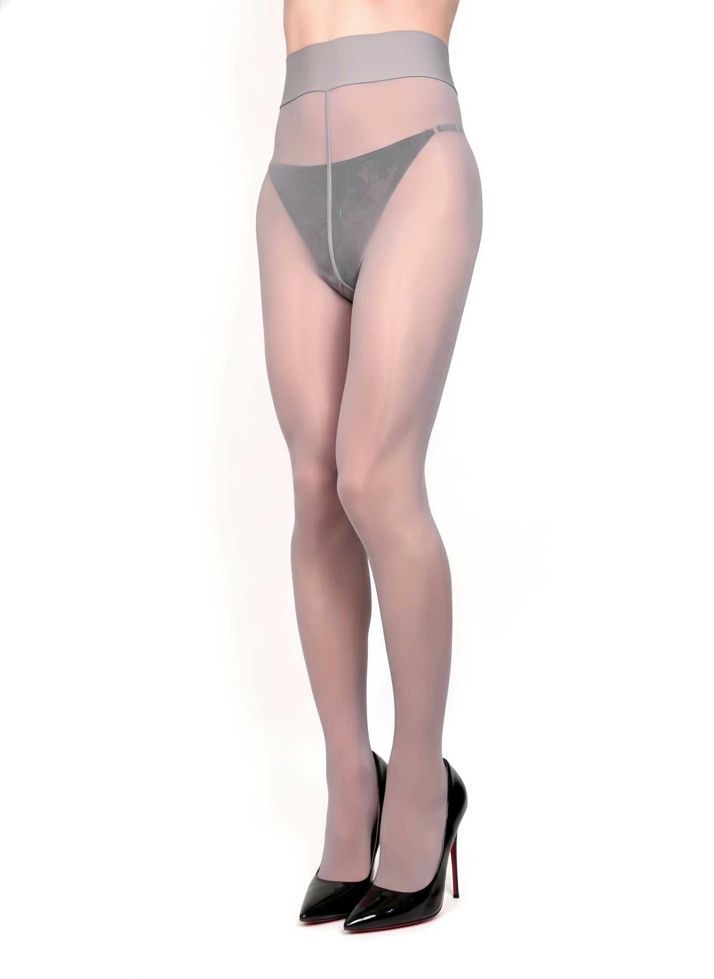 Person wearing sheer black stockings with gray thong on a white background