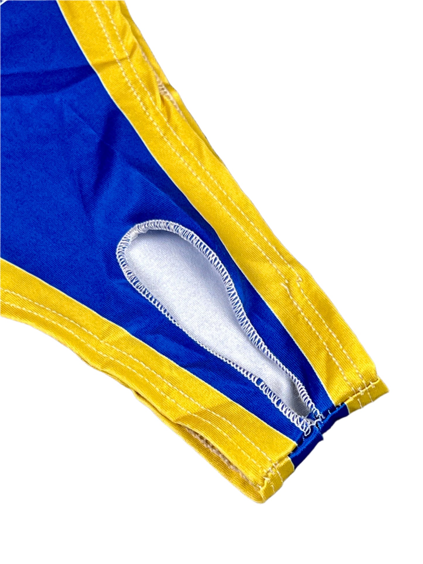 Close-up of blue and yellow fabric with a brand logo on a textured gray background