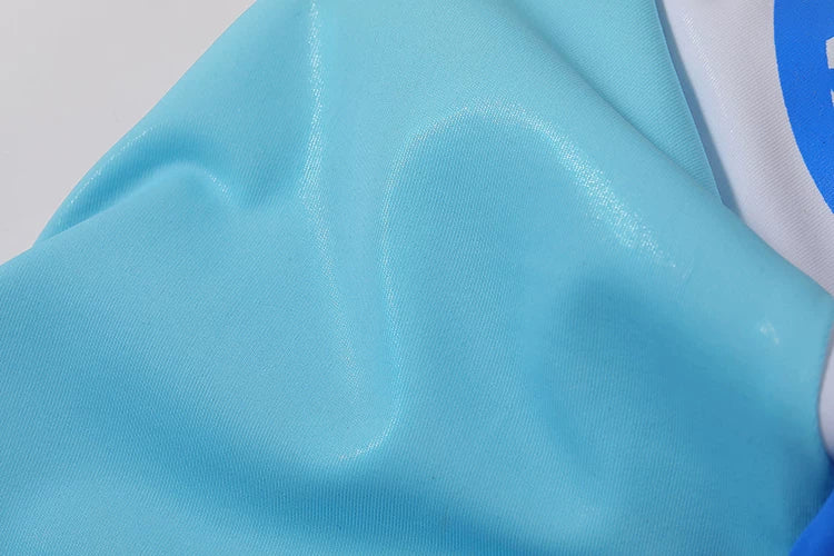 Close-up of a blue fabric with a brand logo in the corner
