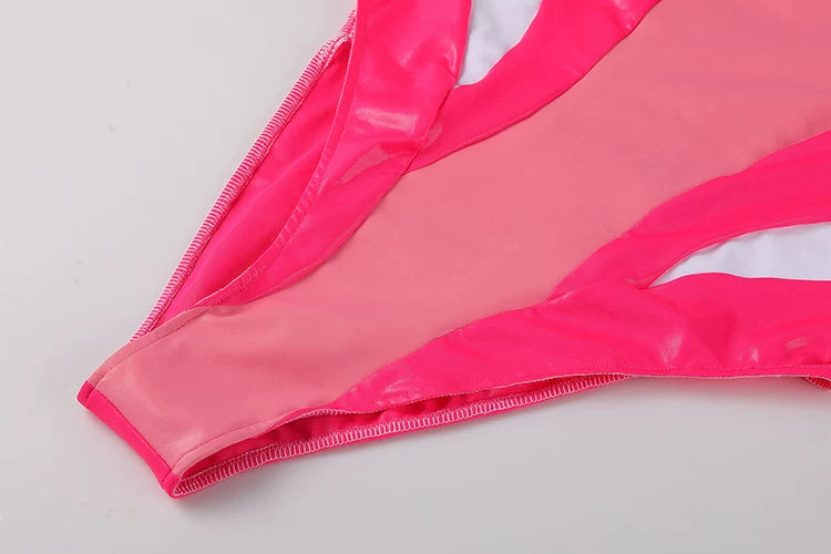 Close-up of a pink bikini bottom on a light gray background