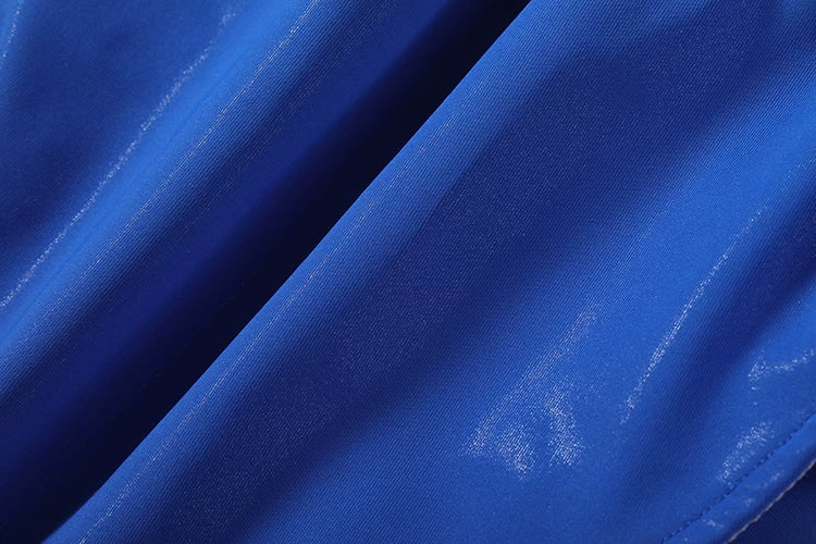 Close-up of blue fabric with a subtle pattern