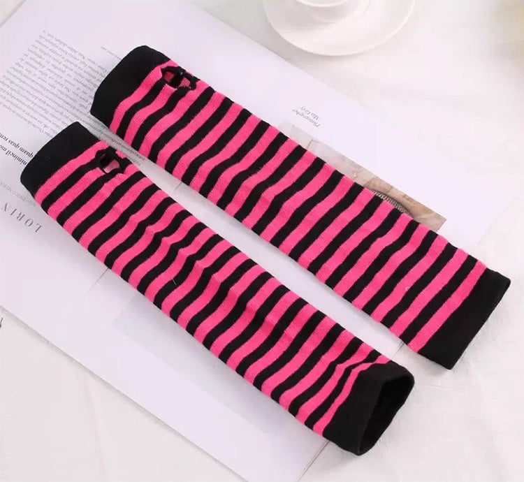 Black and pink striped arm sleeves on a magazine page.